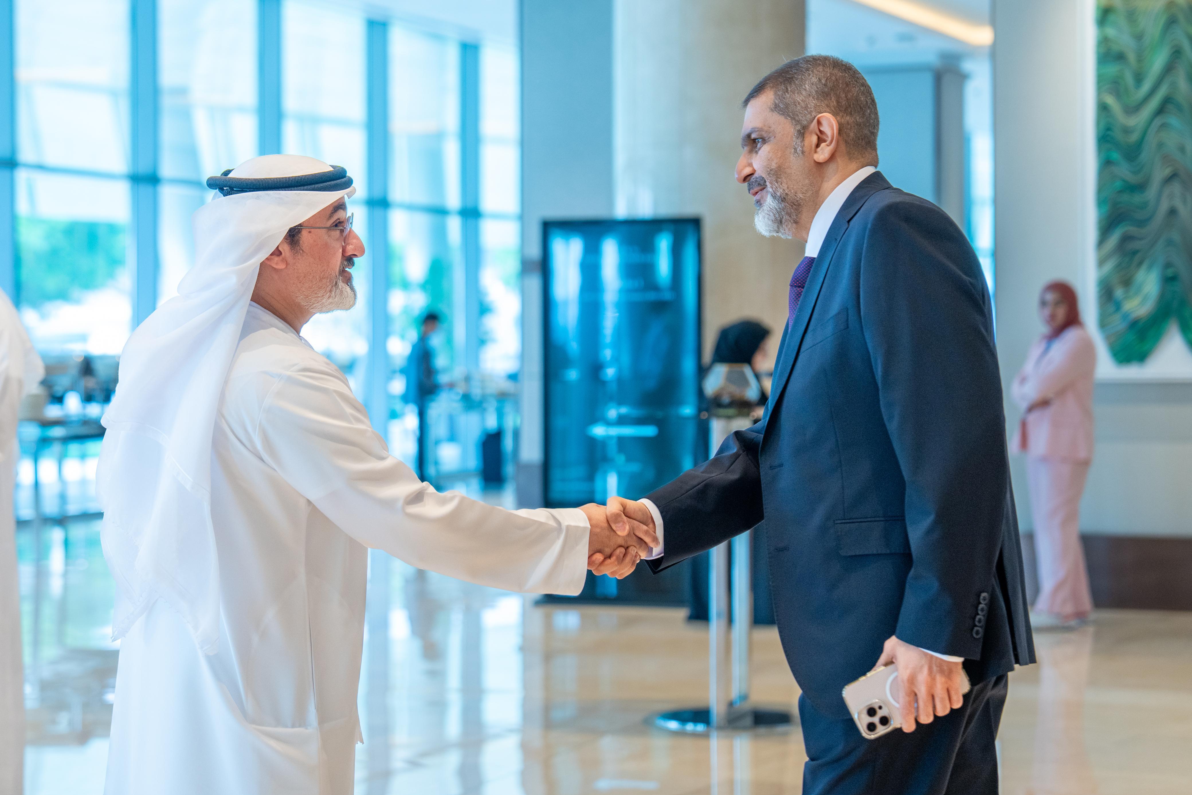 Farshid Heydari, on the right, greeting another attendee